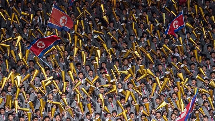 Pendukung tim sepakbola wanita Korea Selatan dan Korea Utara. Copyright: © AFP/Getty Images