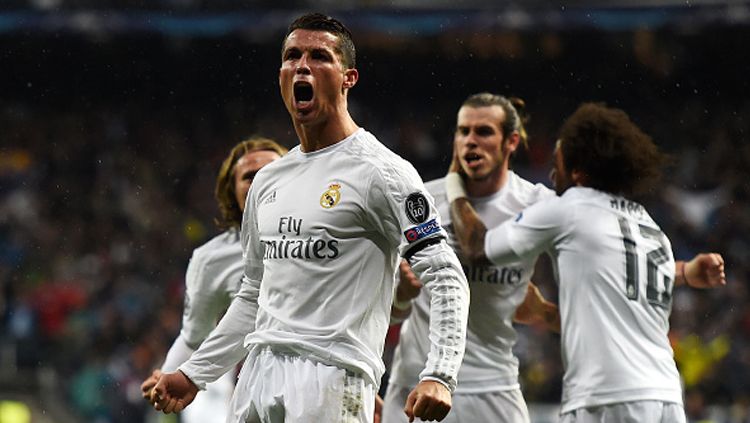 Ronaldo melakukan selebrasi usai cetak gol ke-2 ke gawang VfL Wolfsburg. Copyright: © Mike Hewitt/Getty Images