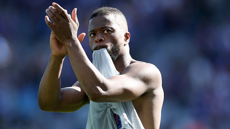 Eks pemain Manchester United, Patrice Evra, kemungkinan akan diinvestigasi usai unggahan media sosialnya saat PSG vs Manchester United bermasalah. Copyright: © Romain Perrocheau/Getty Images