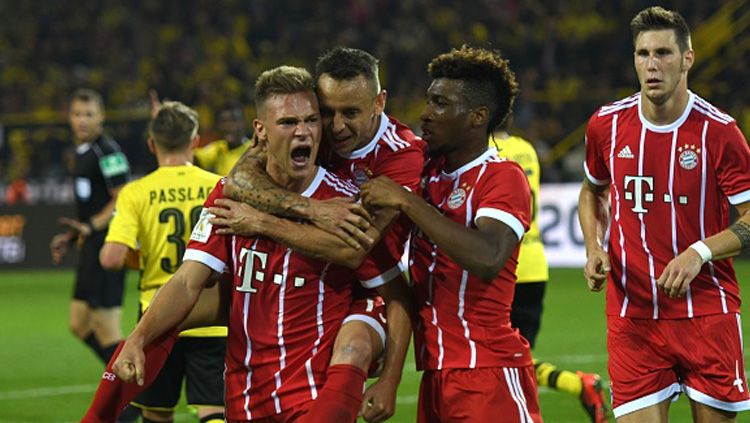Selebrasi para pemain Bayern Munchen usai mencetak gol ke gawang Dortmund. Copyright: © Getty Images
