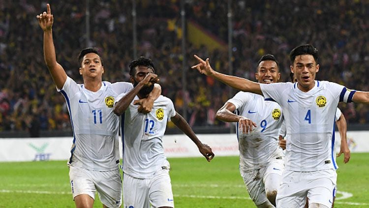 Selebrasi pemain Malaysia setelah Thanabalan Nadarajah menjebol gawang Timnas Indonesia U-22 di semifinal SEA Games 2017 (26/8/17). Copyright: © Getty Images