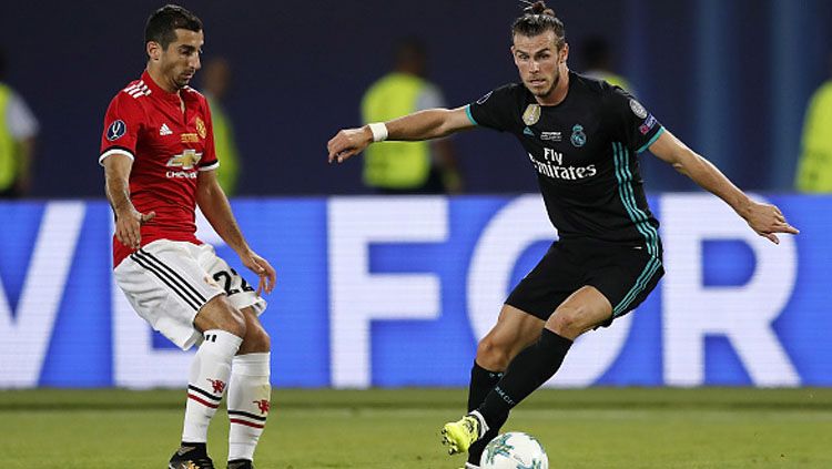 Gareth Bale saat mengontrol bola dari Henrikh Mkhitaryan. Copyright: © Getty Images