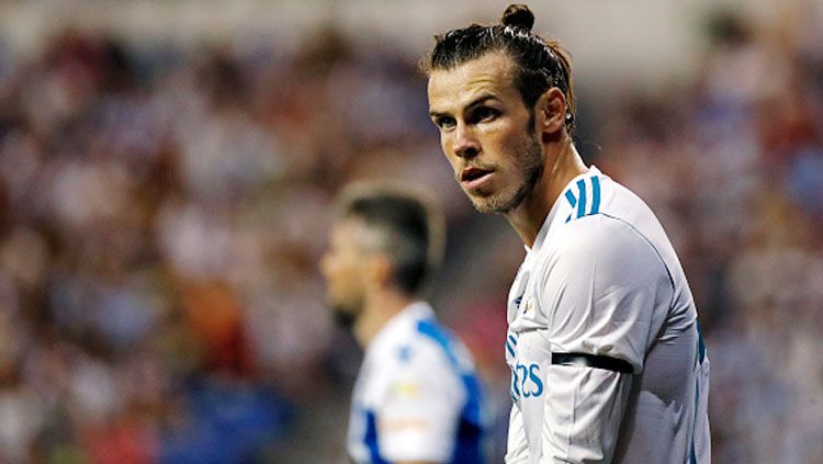 Gareth Bale yang baru saja absen dari skuat Real Madrid untuk Audi Cup 2019, malah bermain golf padahal kondisinya sedang tidak fit. Copyright: © Getty Images