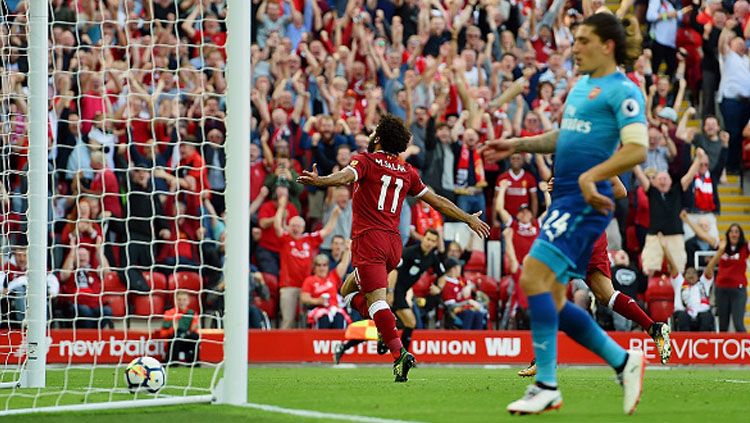 Selebrasi Mohamed Salah usai cetak gol ke gawang Arsenal. Copyright: © Getty Images