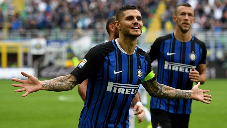 Mauro Icardi melakukan selebrasi usai cetak gol pembuka melawan SPAL. Copyright: &copy; inter