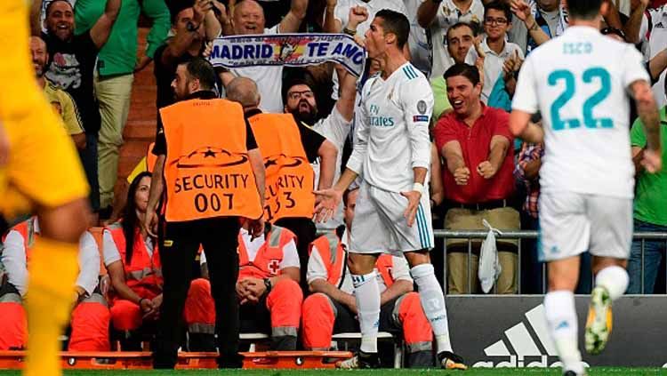 Selebrasi pemain megabintang Real Madrid, Cristiano Ronaldo usai menjebol gawang Apoel. Copyright: © getty images