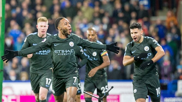 Pemain Manchester City melakukan selebrasi. Copyright: © Getty Images