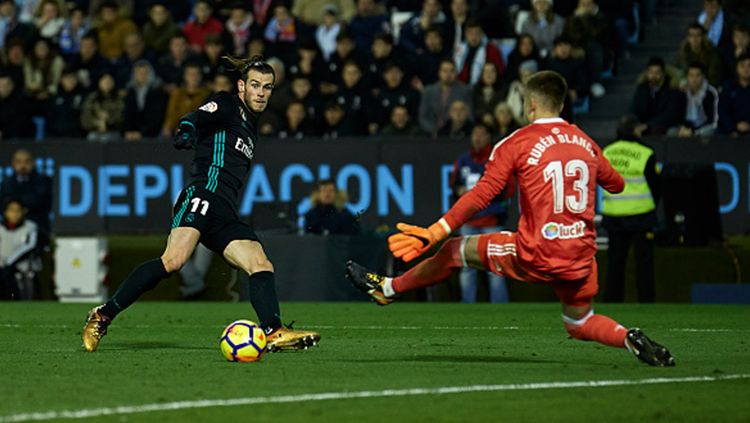 Gareth Bale saat membobol gawang Celta Vigo. Copyright: © Getty Images