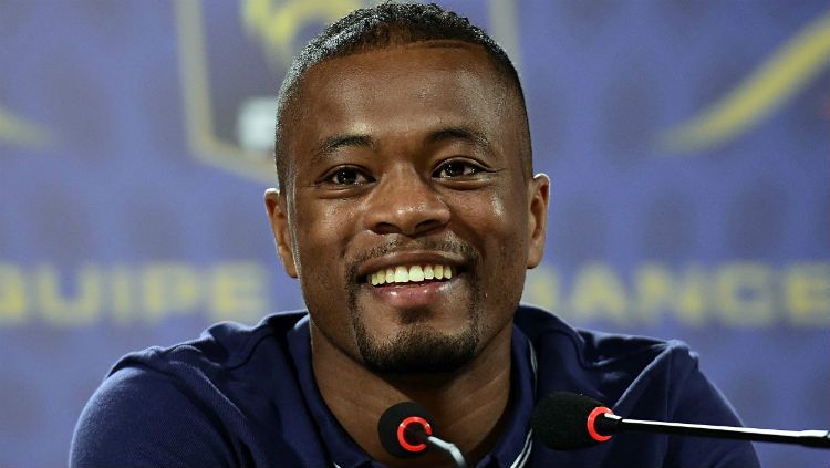 Eks bek Manchester United, Patrice Evra, akan melanjutkan karier sebagai pelatih usai pensiun dari sepak bola. Copyright: © iforsports.com