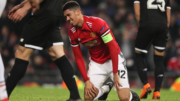 Ekspresi kekecewaan Chris Smalling. Copyright: © Getty Images