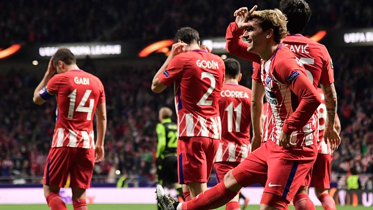 Antoine Griezmann berselebrasi usai mencetak gol ke gawang Sporting Lisbon. Copyright: © Getty Image