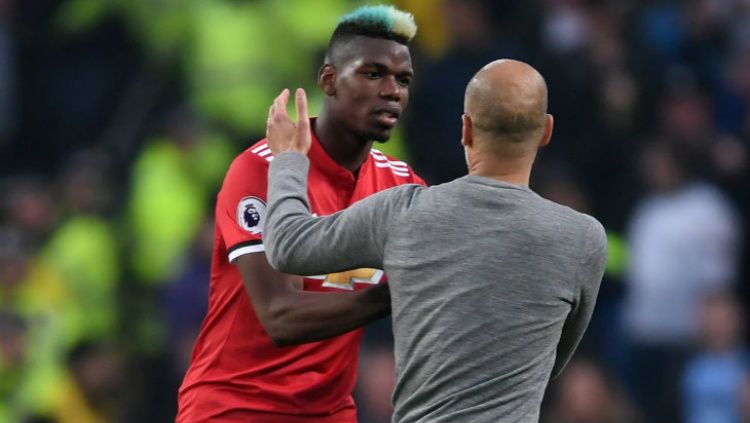 Paul Pogba dan Pep Guardiola usai Derby Manchester. Copyright: © Getty Image