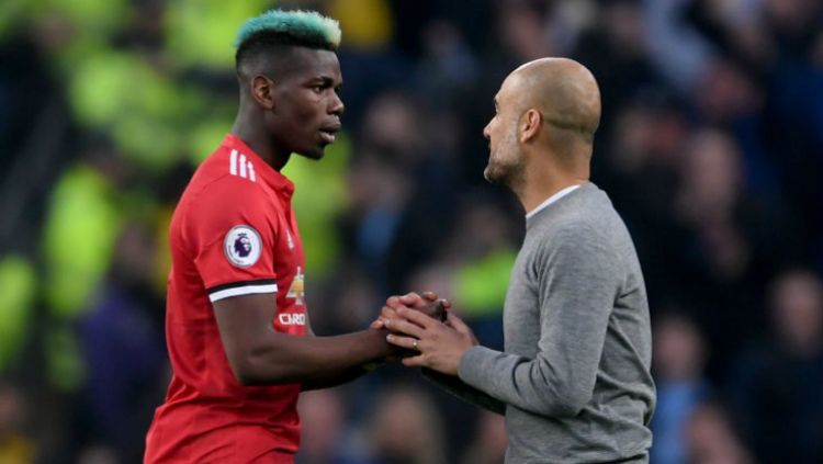 Paul Pogba dan Pep Guardiola usai Derby Manchester Copyright: © Getty Image