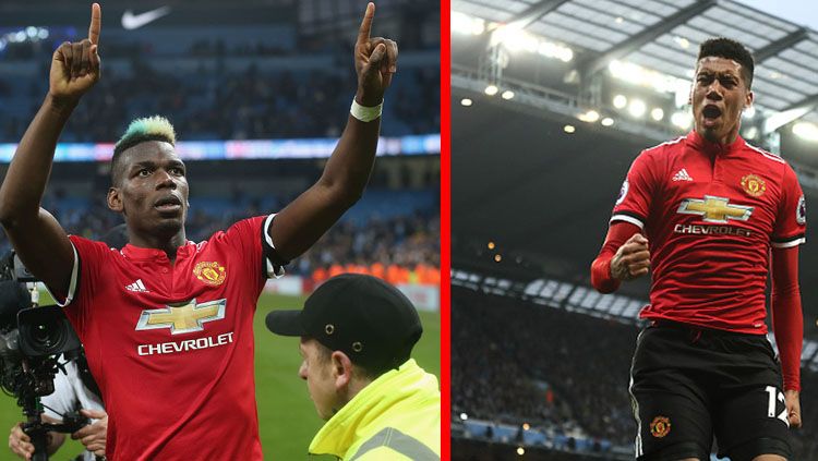 Paul Pogba (kiri) dan Chris Smalling, dua pemain bintang Man United. Copyright: © Getty Image