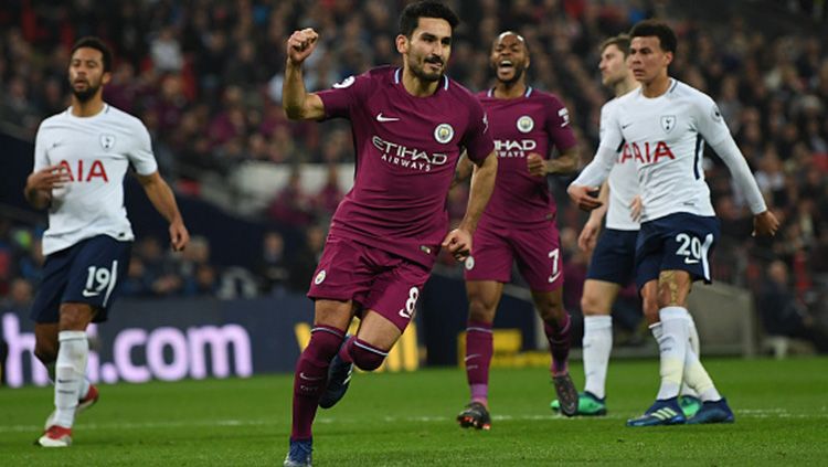 Ilkay Gundogan mencetak gol ke gawang Tottenham Hotspur dari titik penalti. Copyright: © Getty Images