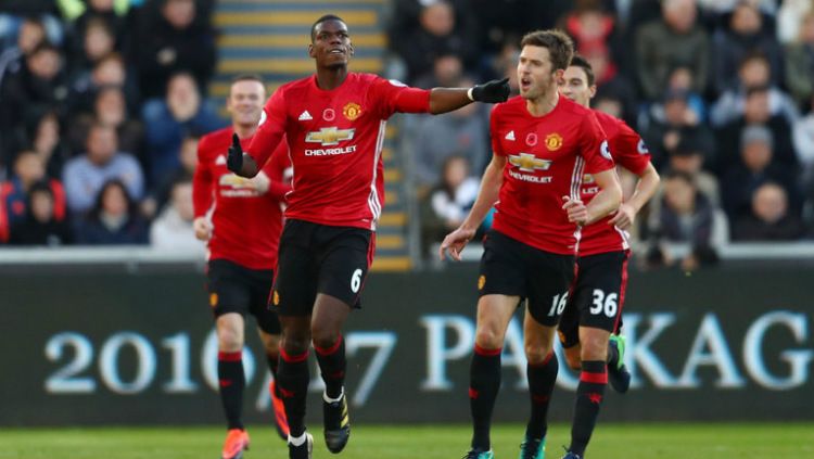 Jose Mourinho dan Paul Pogba. Copyright: Â© INDOSPORT