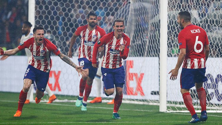 Antoine Griezmann merayakan gol kedua ke gawang Marseille. Copyright: © INDOSPORT