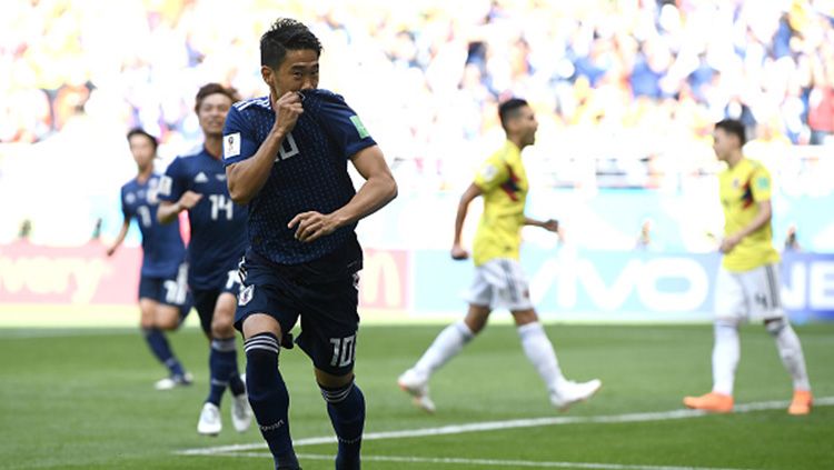 Perayaan gol pertama Jepang ke gawang Kolombia yang dicetak oleh Shinji Kagawa pada menit ke-6, laga Grup H Piala Dunia 2018, Selasa (19/06/18). Copyright: © Getty Images