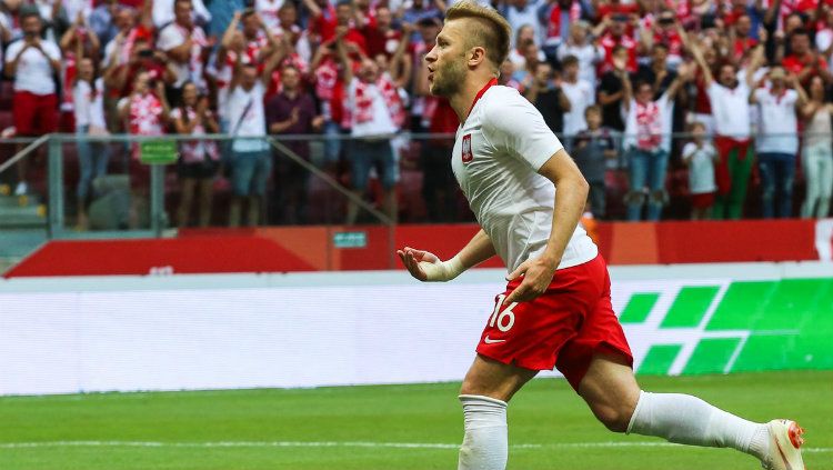 Pemain sayap Polandia Jakub Blaszczykowski merayakan gol. Copyright: © Getty Images