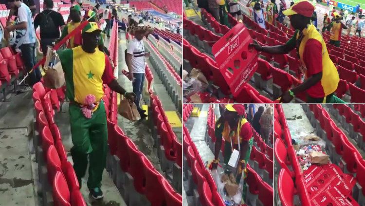 Para suporter Senegal membersihkan sampah yang ada di tribune penonton pasca pertandingan Polandia vs Senegal di Piala Dunia 2018. Copyright: © Getty Images
