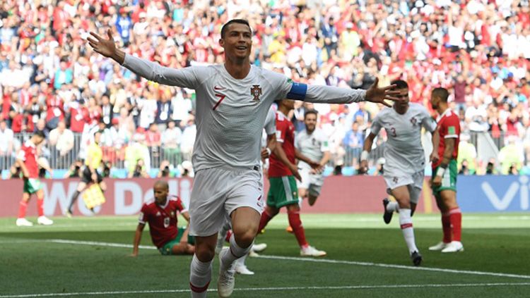 Selebrasi Cristiano Ronaldo saat mencetak gol pembuka ke gawang Maroko. Copyright: © Getty Images