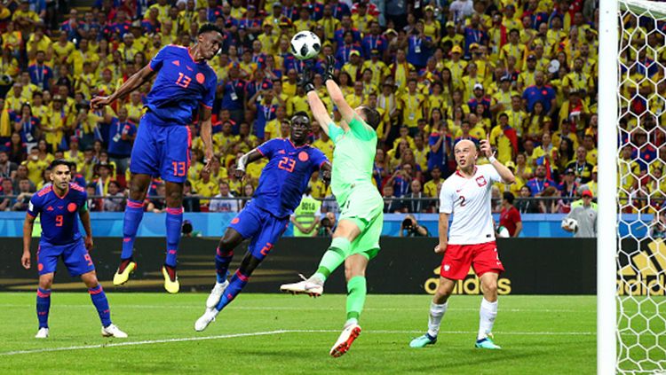 Yerry Mina mencetak gol ke gawang Polandia Copyright: © Getty Images