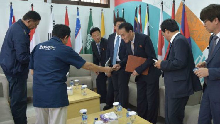 Korea Selatan dan Korea Utara bersatu di tiga cabang olahraga Asian Games 2018. Copyright: © AFP/Adek Berry