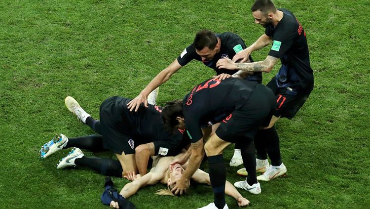 Para pemain Kroasia merayakan kemenangan atas Rusia di Piala Dunia 2018. Copyright: © Getty Images