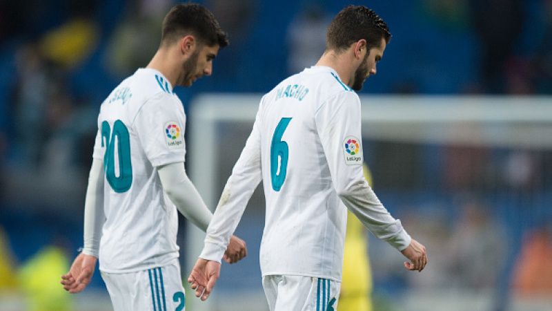 Nacho dan Marco Asensio pergi meninggalkan lapangan pasca dikalahkan Villarreal Copyright: © Getty Images