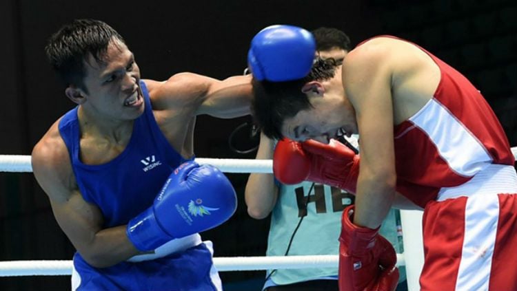 Petinju Filipina, Charly Suarez (kiri) bertarung di Asian Games 2014. Copyright: © Rappler