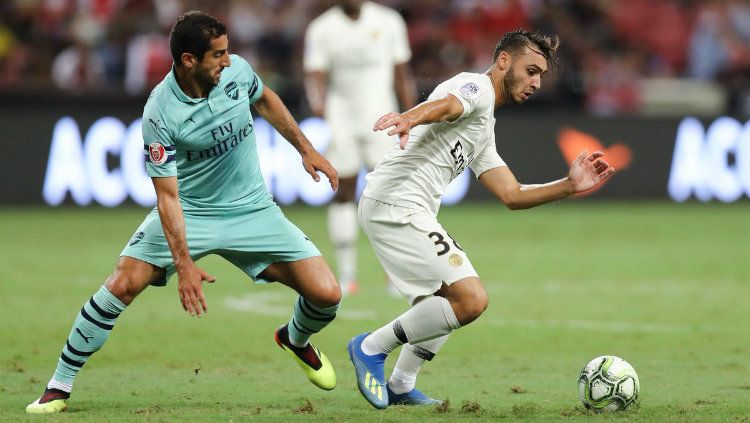 Pemain Arsenal Henrikh Mkhitaryan yang menghalau pemain PSG di ICC 2018.jpg Copyright: © Getty Images