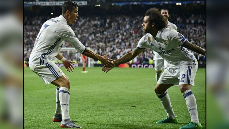 Marcelo dan Cristiano Ronaldo saat masih sama-sama di Real Madrid. Copyright: © Getty Images