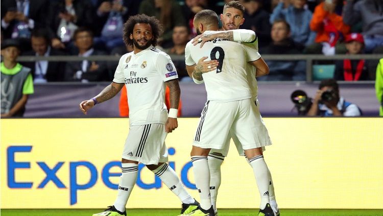 Sergio Ramos (kanan) bersama Benzema dan Marcelo (kiri) merayakan gol ke gawang Atletico Madrid Copyright: © Getty Images