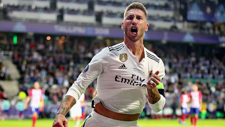 Aksi selebrasi Sergio Ramos usai cetak gol ke gawang Atletico Madrid. Copyright: © Getty Images