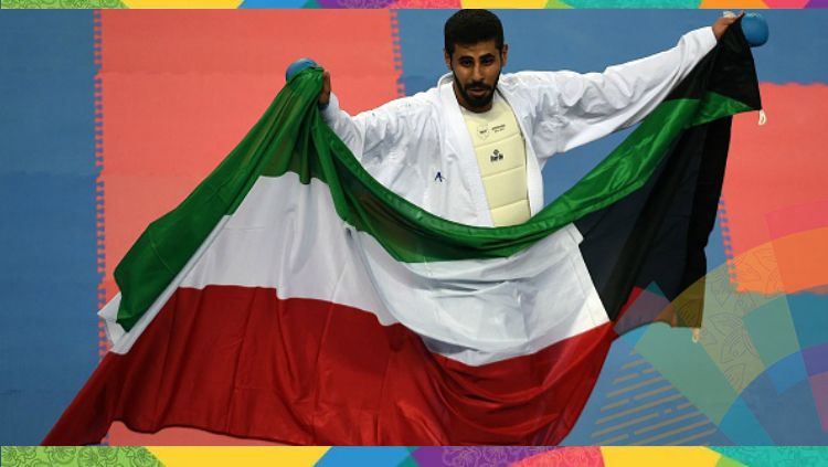 Atlet karate Kuwait, Rasheed al-Mutairi usai mengalahkan Jepang dalam Asian Games 2014. Copyright: © INDOSPORT