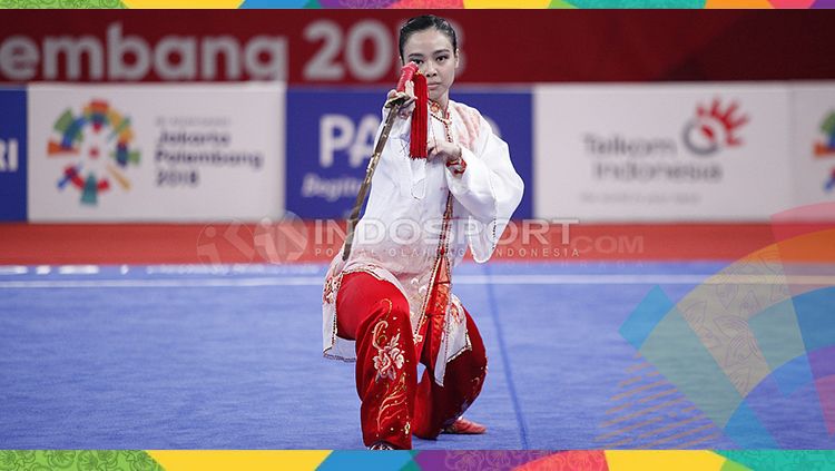 Atlet wushu Indonesia, Lindswell Kwok sabet medali emas Asian Games 2018. Copyright: © INDOSPORT/Herry Ibrahim