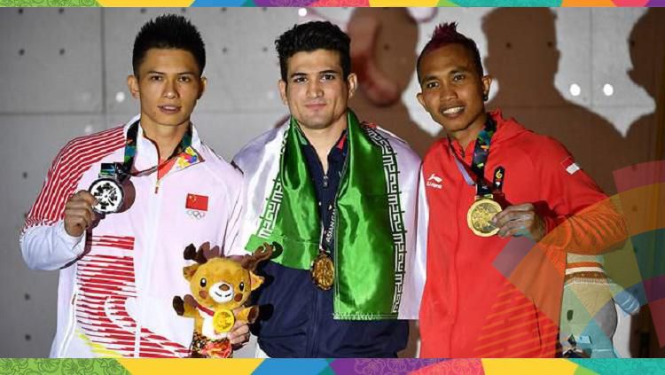 Tiga juara panjat tebing Asian Games 2018, Reza Alipour (tengah), Zong Qixin (kiri), Aspar Jaelolo (kanan) Copyright: © AFP