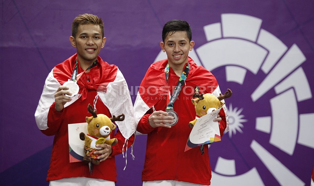Fajar Alfian/Muhammad Rian Ardianto raih medali perak di Asian Games 2018. Copyright: © Herry Ibrahim/INDOSPORT