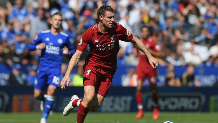 James Milner, melakukan selebrasi yang aneh saat Liverpool menghalahkan Cardiff City dalam lanjutan Liga Primer Inggris 2018/19. Copyright: © Getty Images