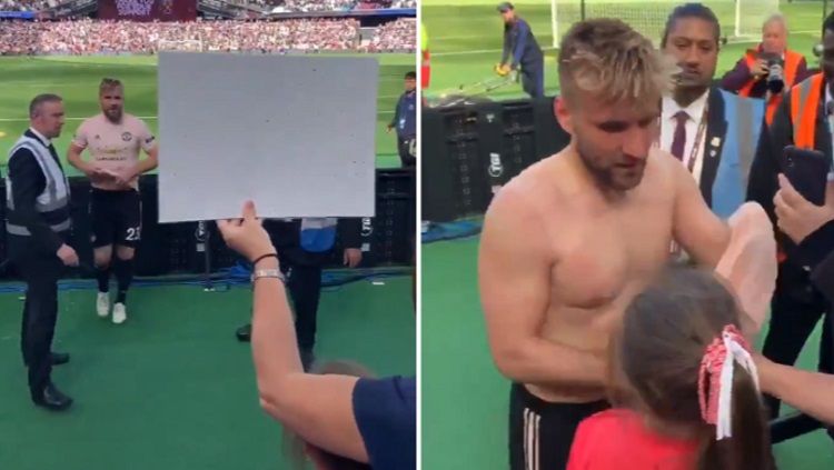 Luke Shaw saat memberikan hadiah kepada seorang gadis kecil usai laga West Ham vs Manchester United, Minggu (30/09/18). Copyright: &copy; Sport Bible