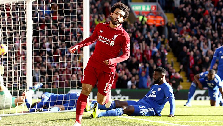 Mohamed Salah berselebrasi seusai mencetak gol ke gawang Cardiff City. Copyright: © Getty Images/Jan Kruger