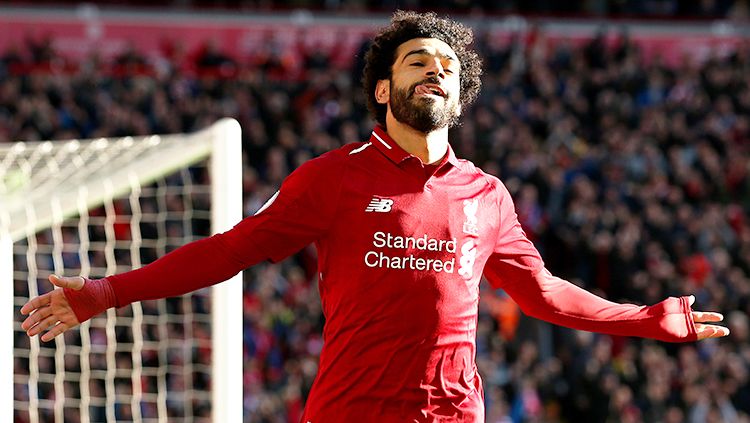 Mohamed Salah berselebrasi seusai mencetak gol ke gawang Cardiff City. Copyright: © Getty Images/Jan Kruger