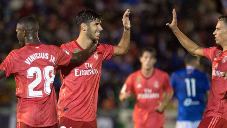 Marco Asensio berselebrasi usai mencetak gol ke gawang Melilla. Copyright: © AS