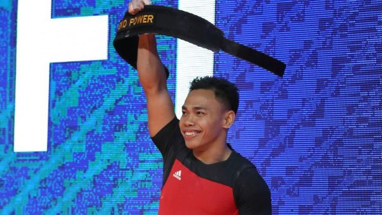 Lifter Tanah Air Eko Yuli Irawan sumbang medali emas ke-7 buat Indonesia di ajang multi-event SEA Games 2019, Senin (02/12/19). Copyright: © IWF.com