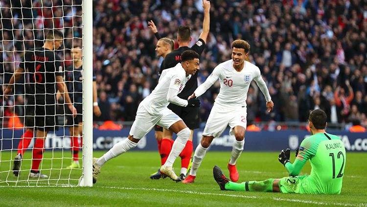 Jesse Lingard berselebrasi usai mencetak gol ke gawang Kroasia. Copyright: © Catherine Ivill/Getty Images