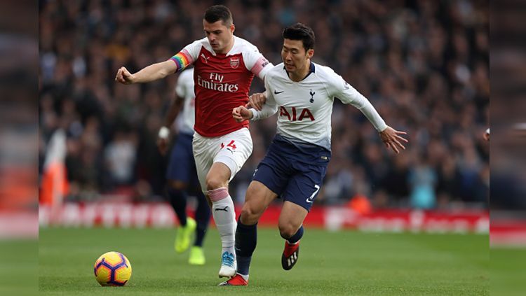 Sebelum laga Arsenal vs Tottenham Hotspur, para pencinta sepak bola dibuat terenyuh oleh unggahan The Gunners di media sosial. Copyright: © Getty Images