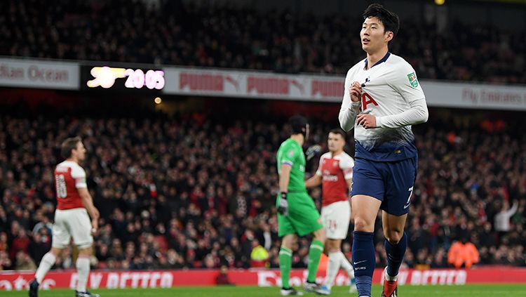 Son Heung-min (kanan) turut mencetak satu gol ke gawang Arsenal. Copyright: © Alex Morton/Getty Images