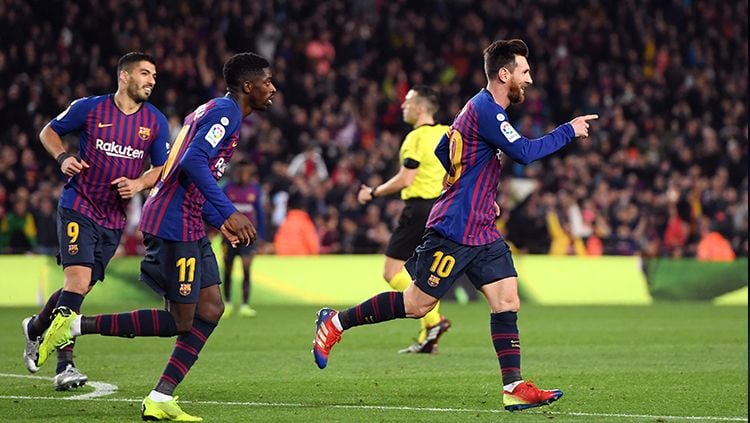Lionel Messi berselebrasi usai mencetka gol ke gawang Celta Vigo. Copyright: © Getty Images