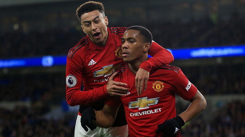 Jesse Lingard selaku gelandang raksasa Liga Inggris, Manchester United, sesumbar Cristiano Ronaldo tak beri dia kesulitan berarti. Copyright: © Getty Images