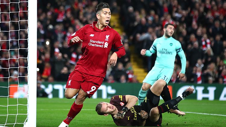 Roberto Firmino berselebrasi usai mencetak gol. Copyright: © Getty Images